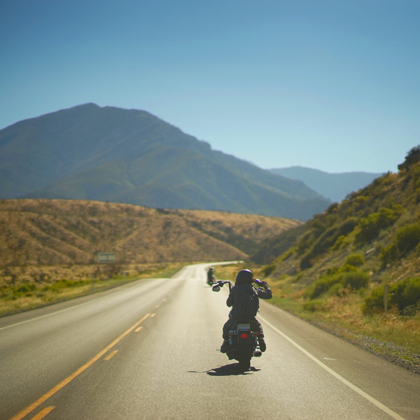 Motorcycles Through The Mountainside Valley