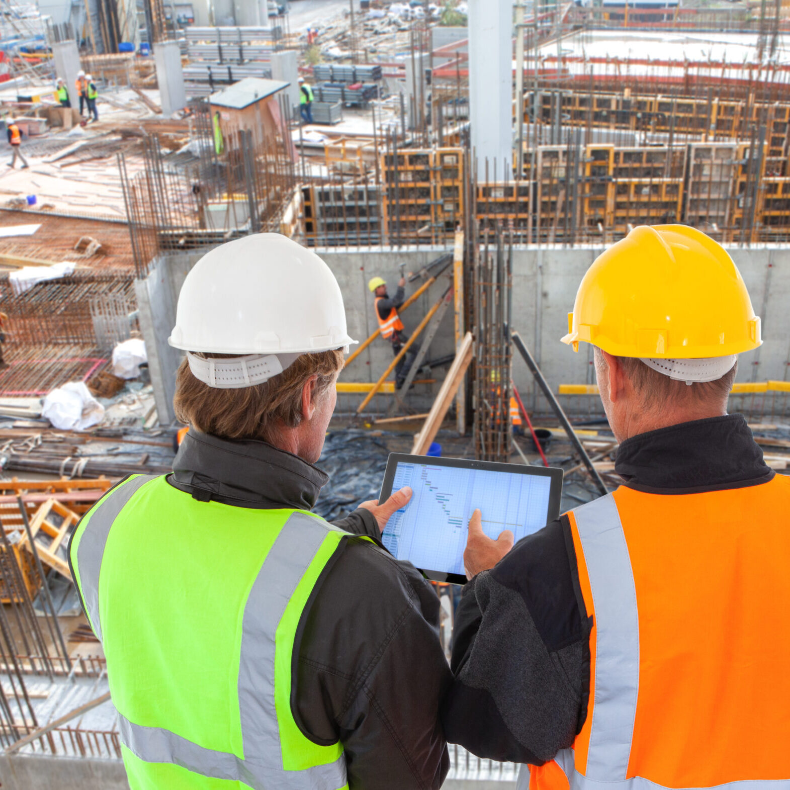 construction worker  engineer architect team at work on major co