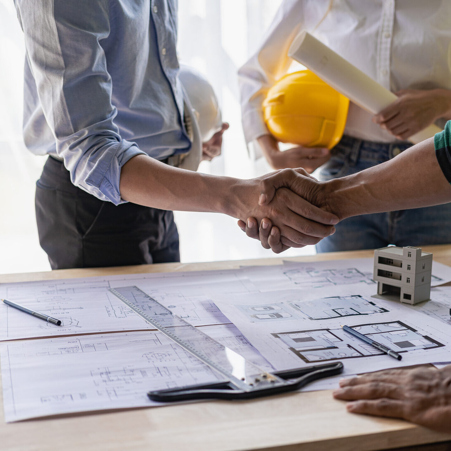 Yellow hard hat on table and house design print design with cons