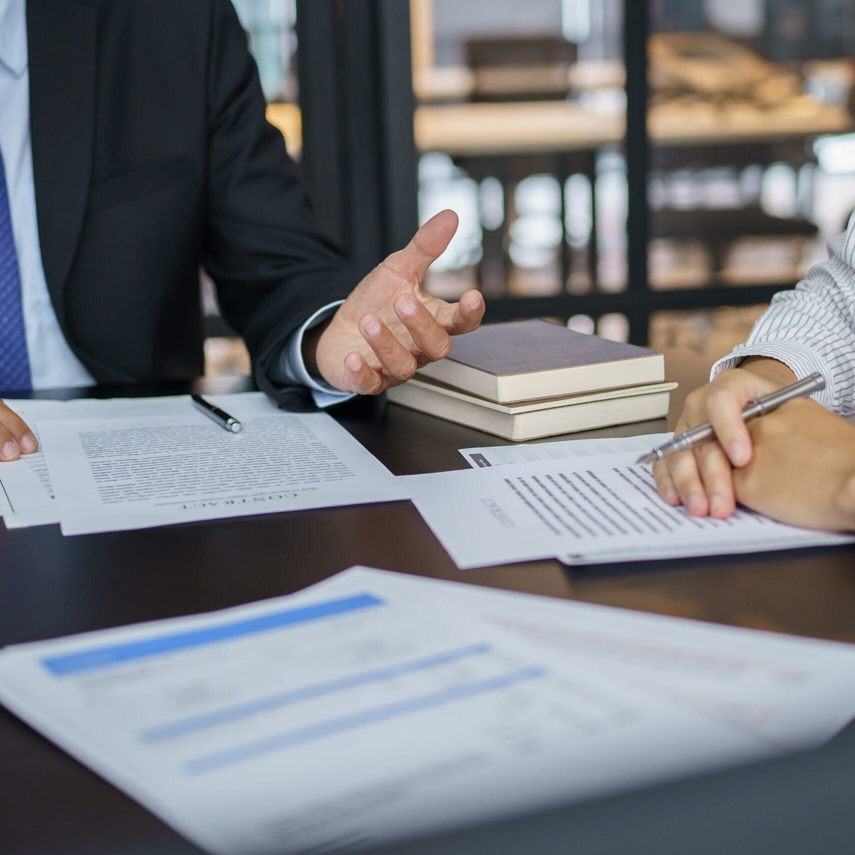 Lawyer Legal counsel presents to the client a signed contract with gavel and legal law. justice and lawyer Business partnership meeting concept